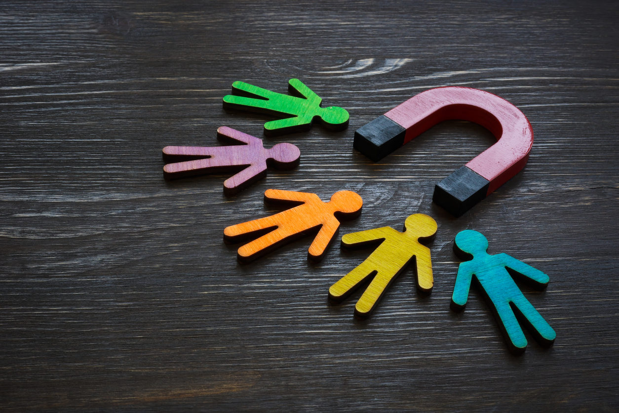 Magnet and wooden figures of people representing a healthy brand.