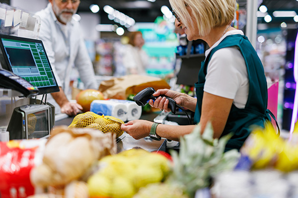 cashier checking out groceries