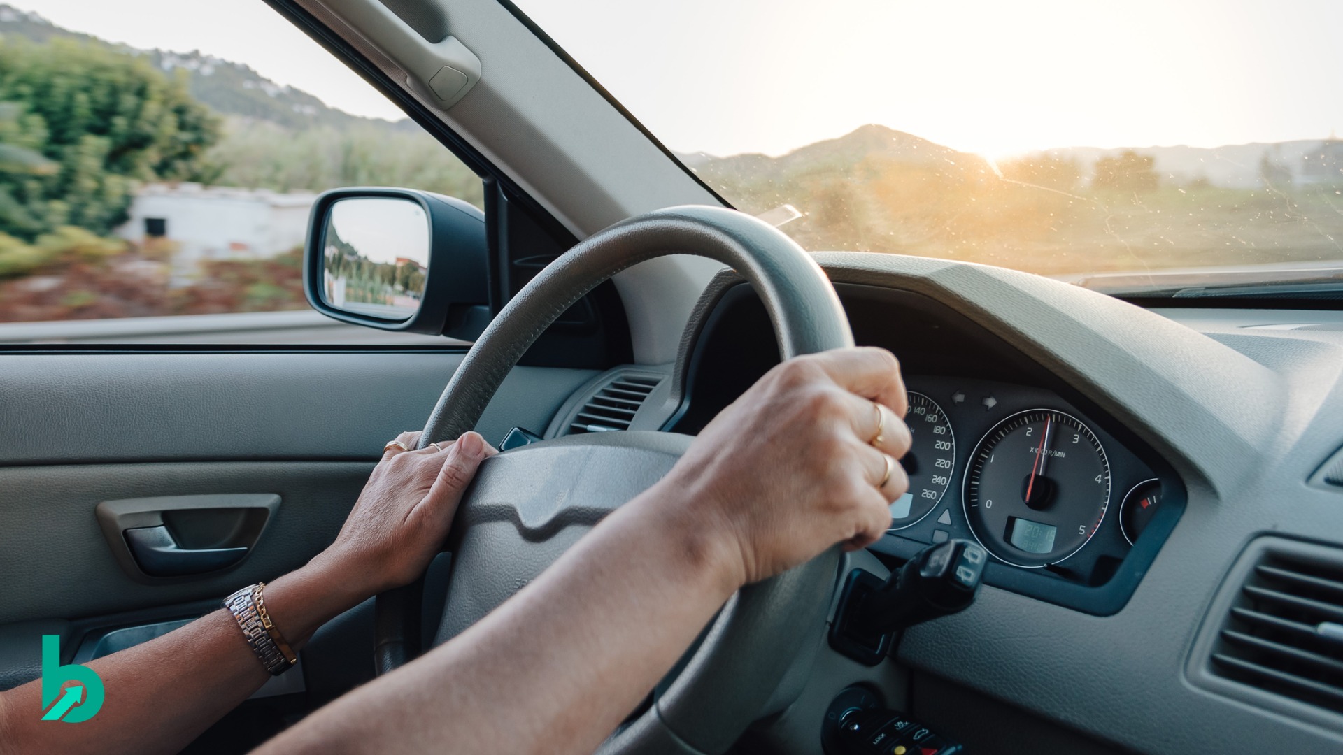 Hands on a steering wheel driving on a busy road, representing how human judgment guides decision-making while advanced tools provide support.