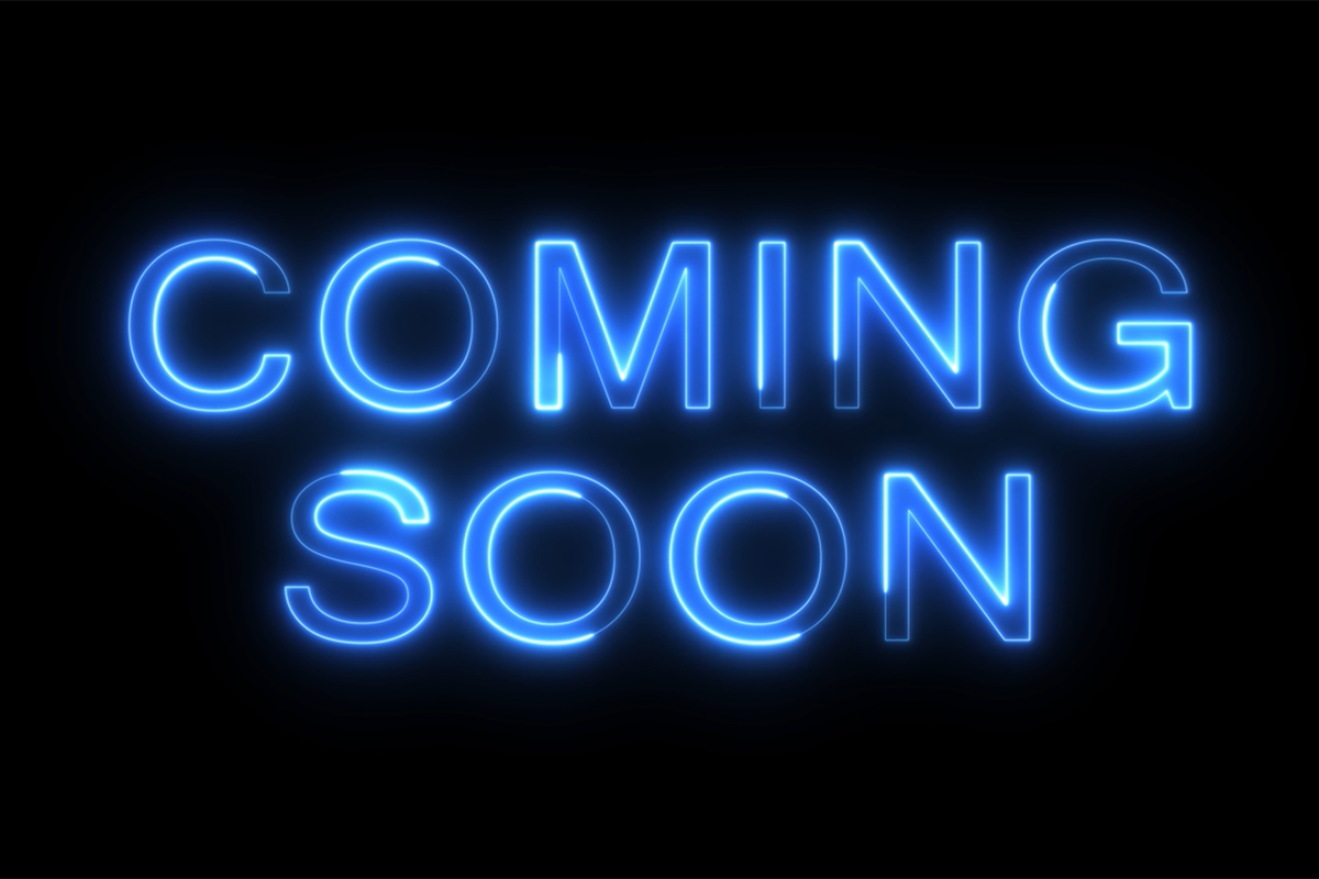 blue neon sign with the words coming soon